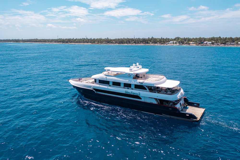 a large white boat in the middle of the ocean