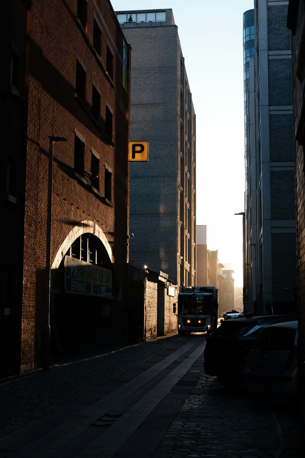 a city street with cars parked on the side of it