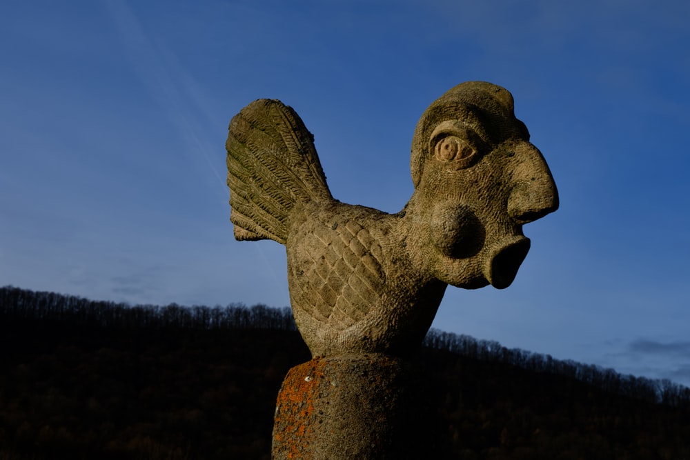 a statue of a bird with its mouth open