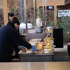 a man preparing food in a restaurant kitchen