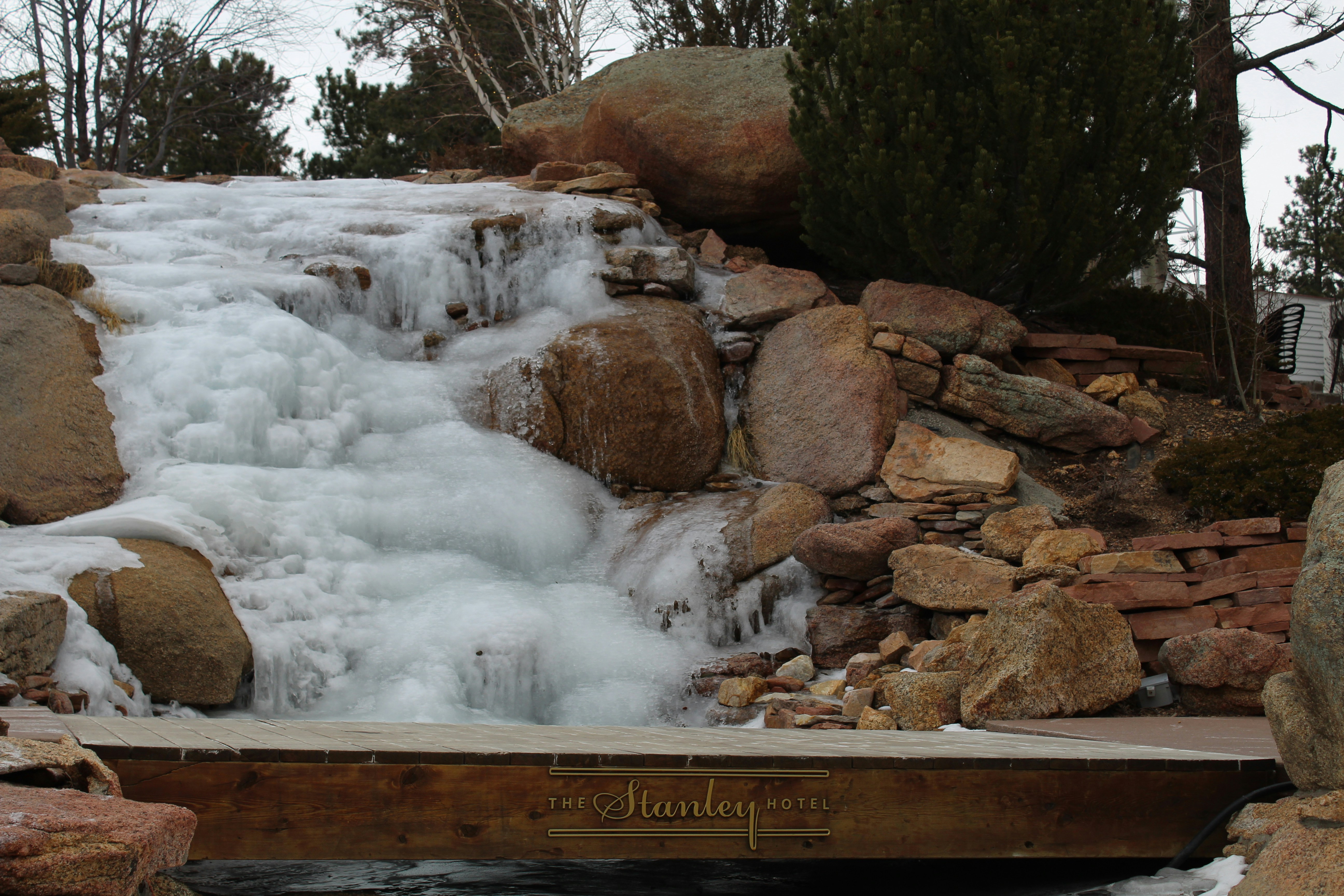 a small waterfall with water coming out of it