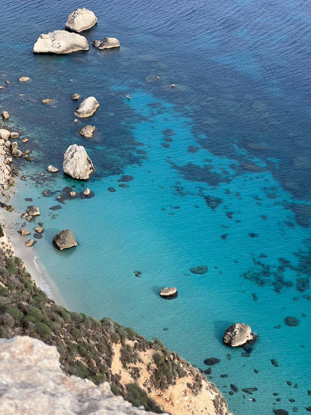 a body of water surrounded by rocks and water