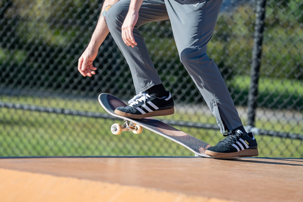 a man riding a skateboard on top of a wooden ramp