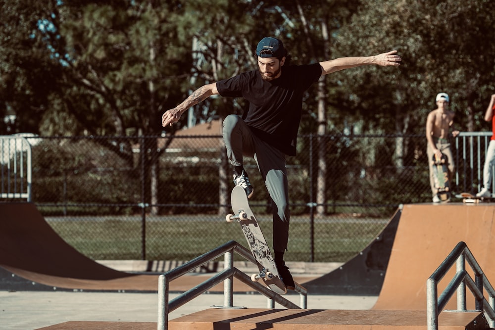 a man riding a skateboard up the side of a ramp