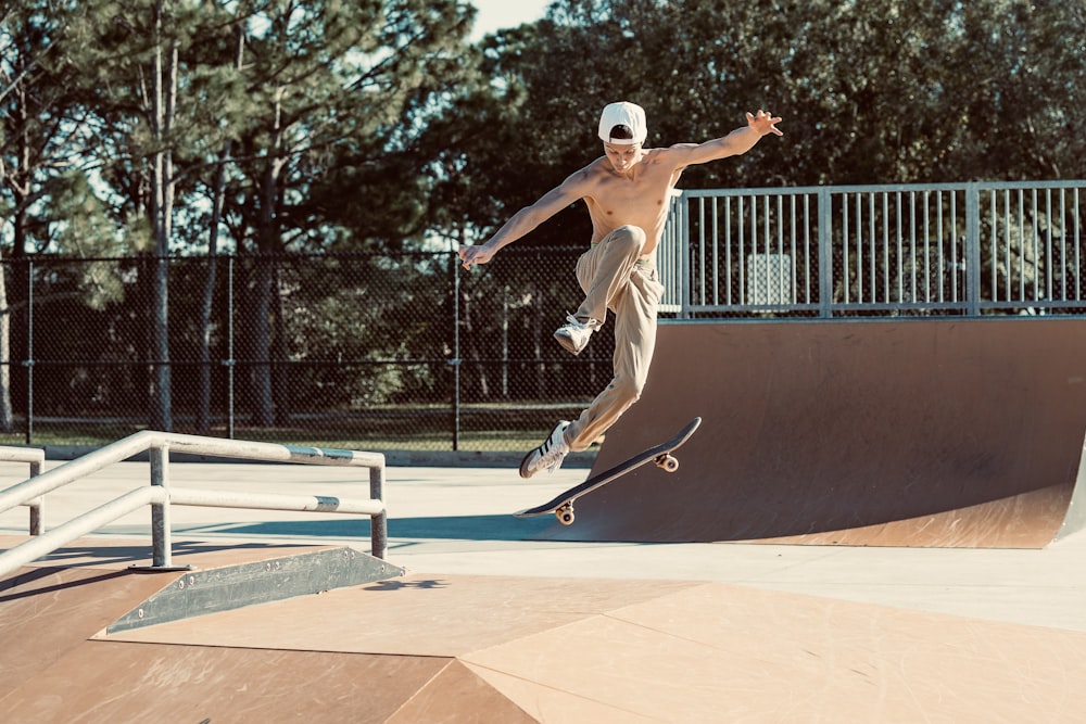 a man riding a skateboard up the side of a ramp