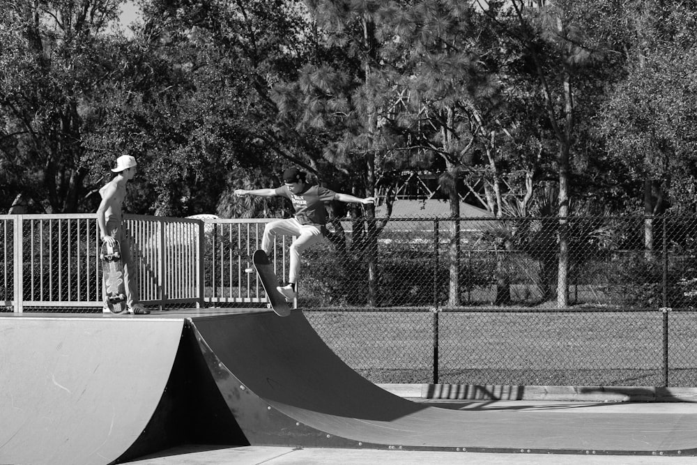 a man riding a skateboard up the side of a ramp