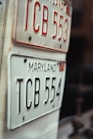 a close up of two license plates on a table