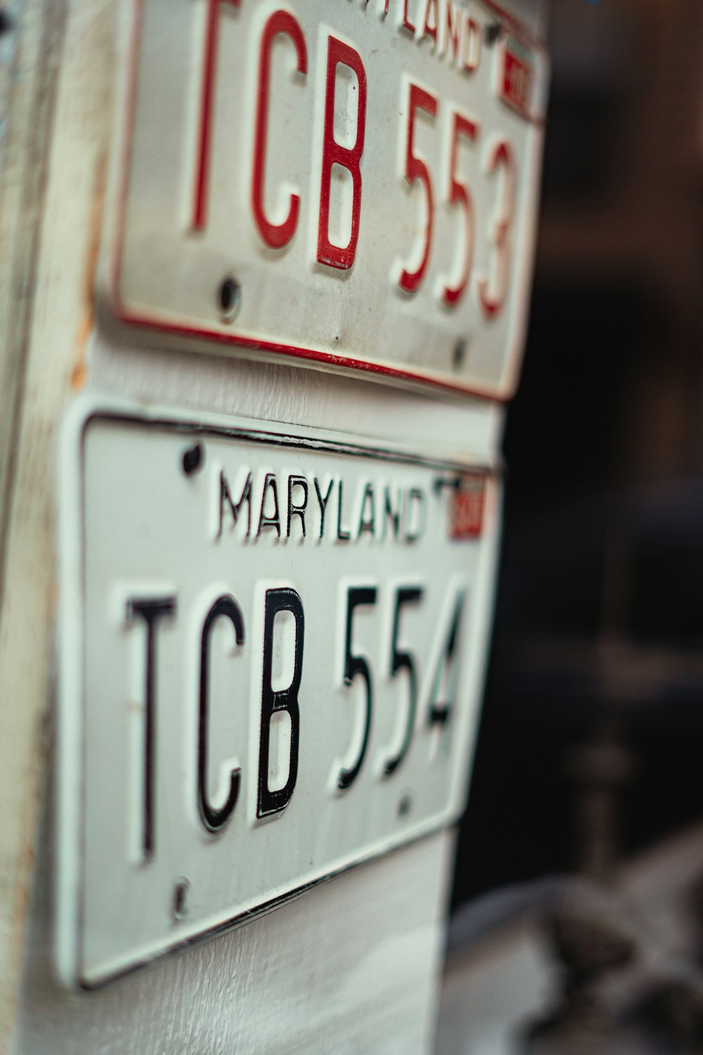 a close up of two license plates on a table