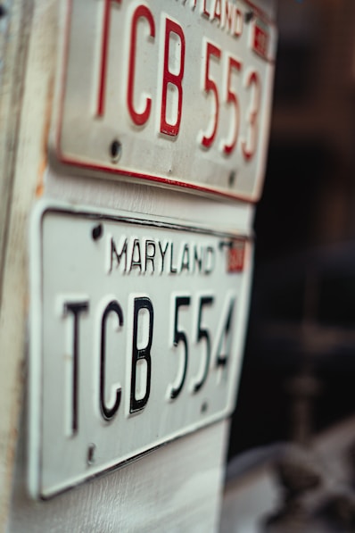 a close up of two license plates on a table