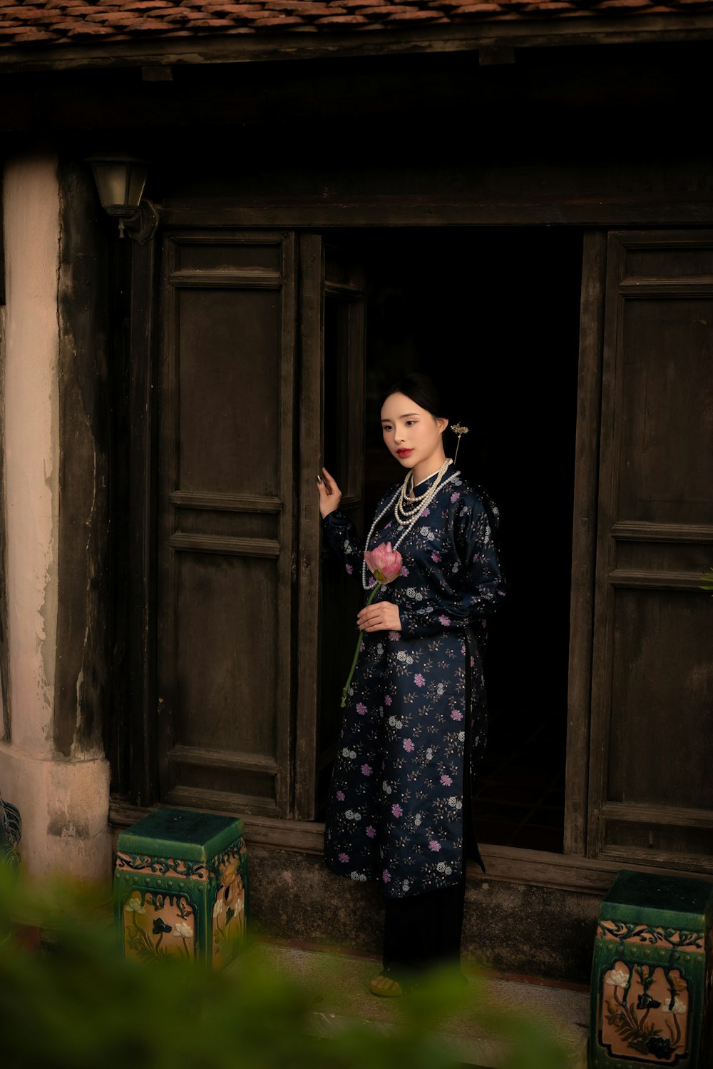 a woman standing in a doorway of a building