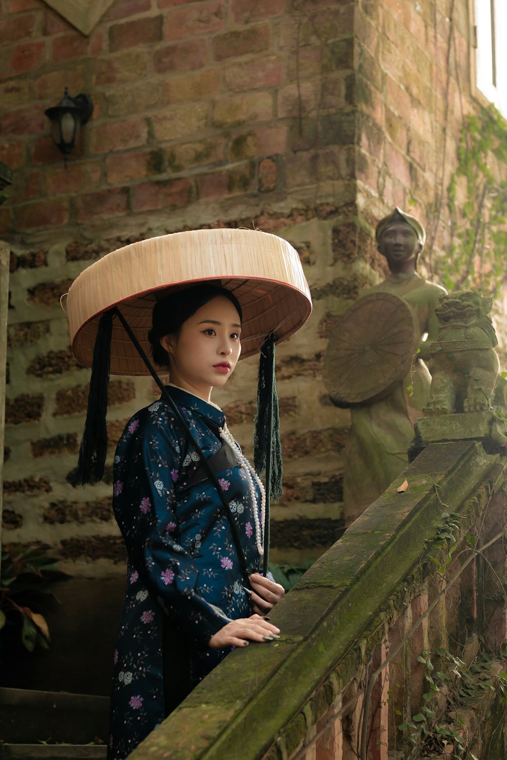 a woman in a kimono with a hat on her head