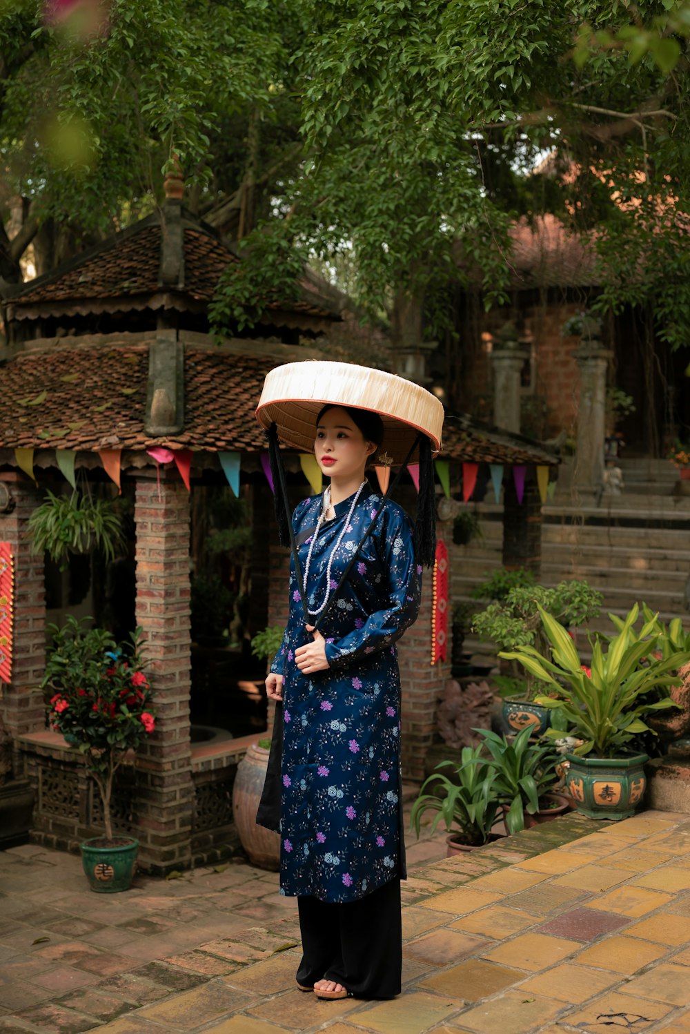 a woman with a hat on her head