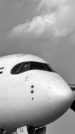 a large jetliner sitting on top of an airport tarmac