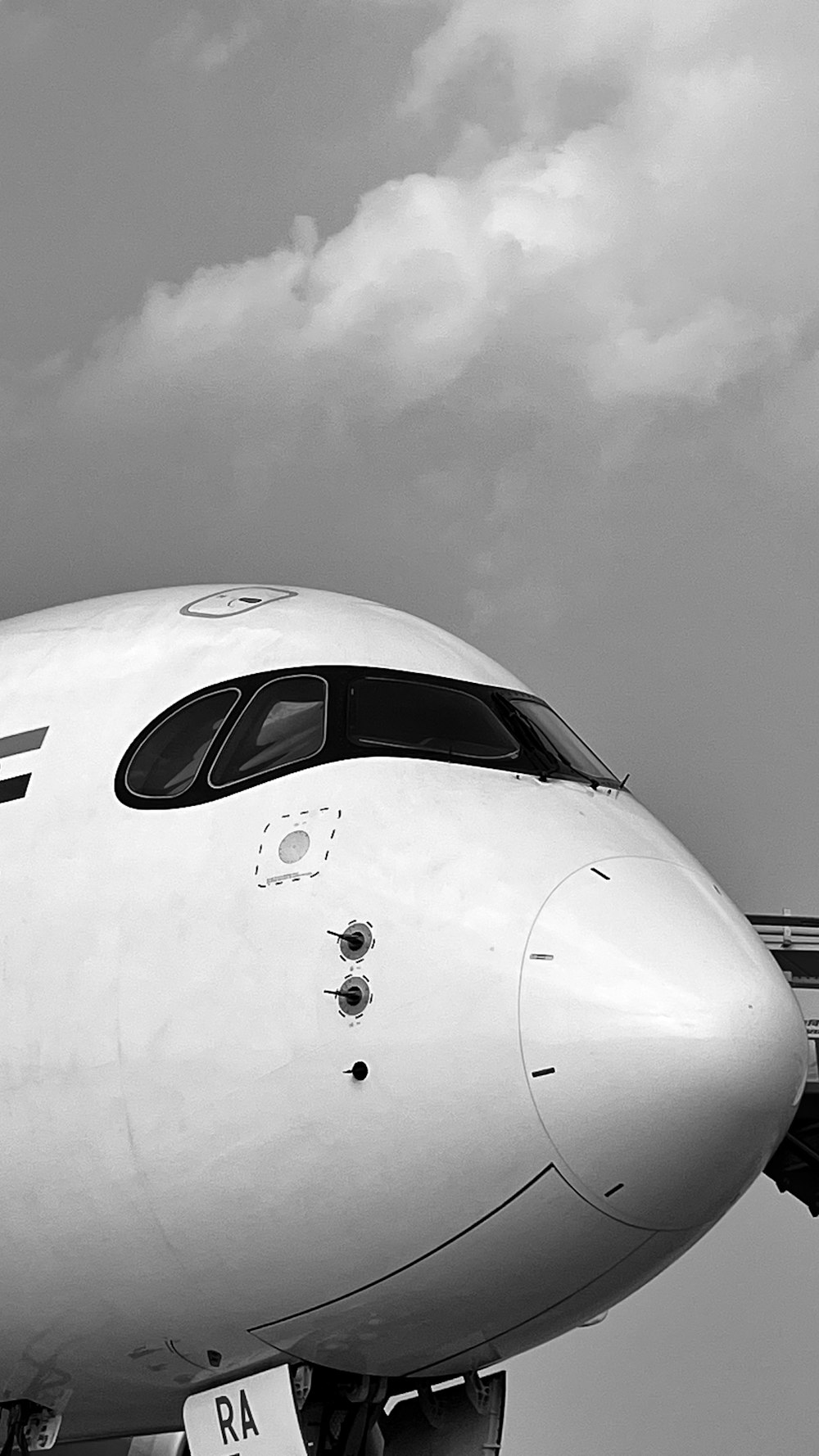 a large jetliner sitting on top of an airport tarmac