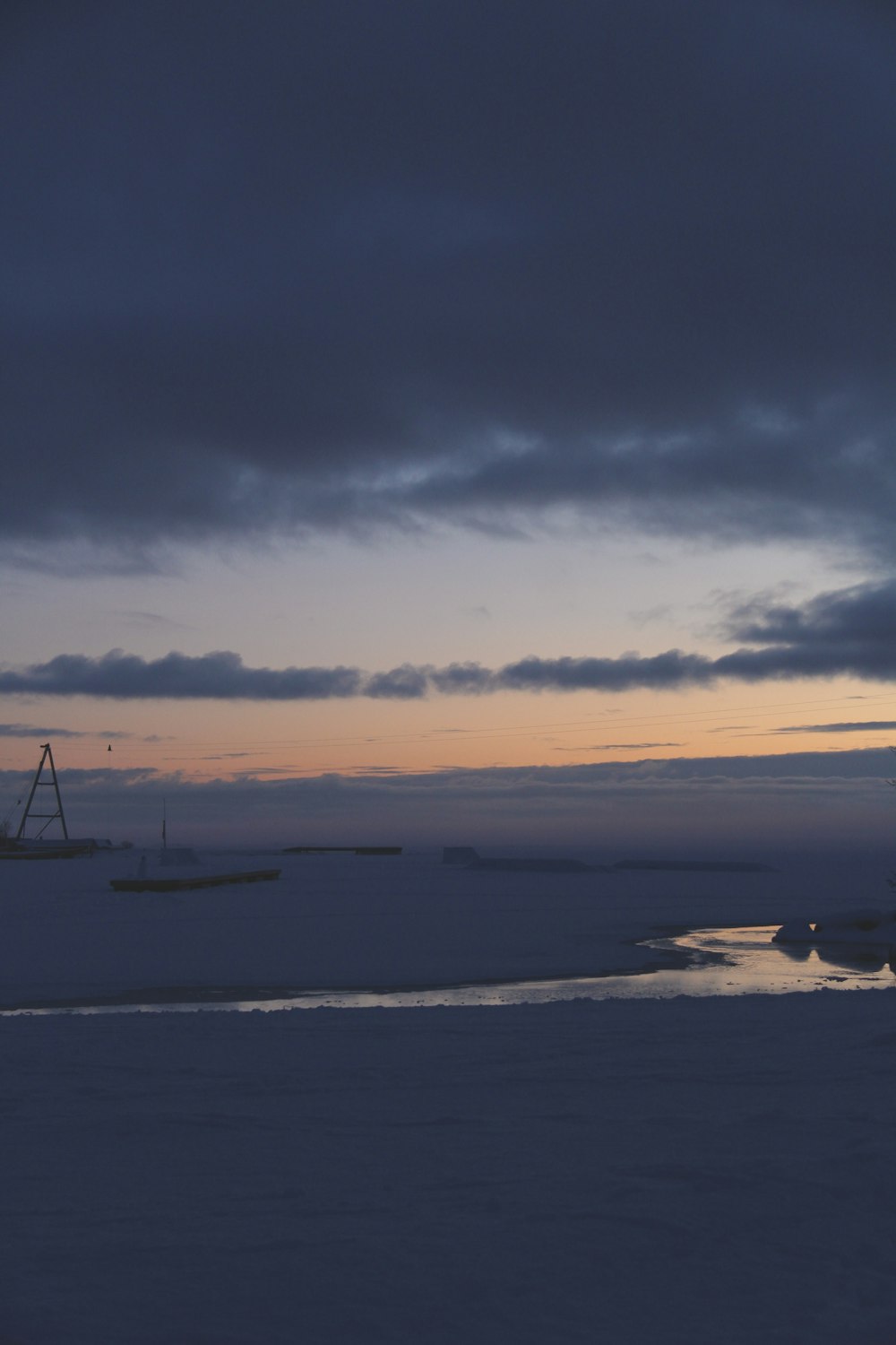 a couple of boats that are sitting in the snow