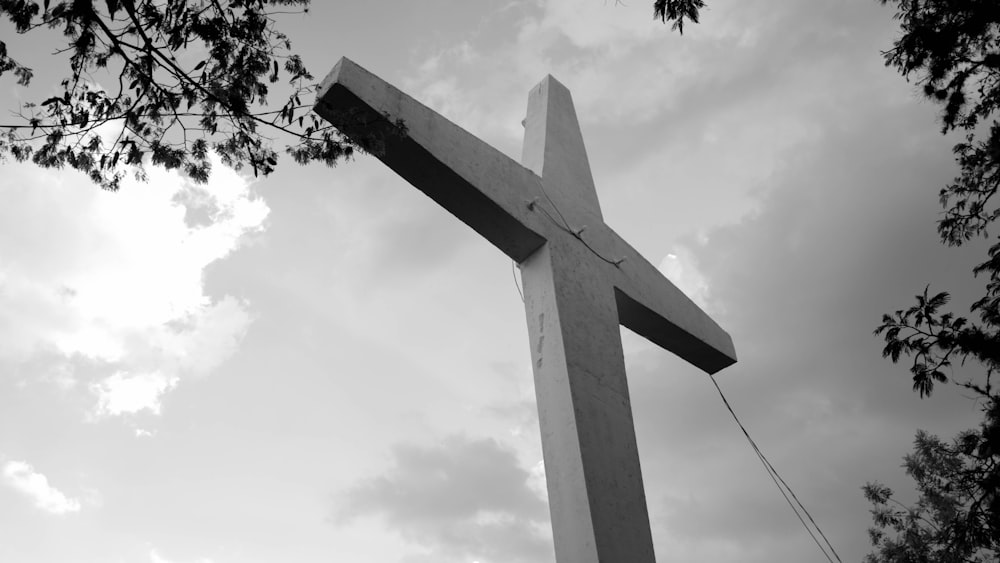 a black and white photo of a large cross