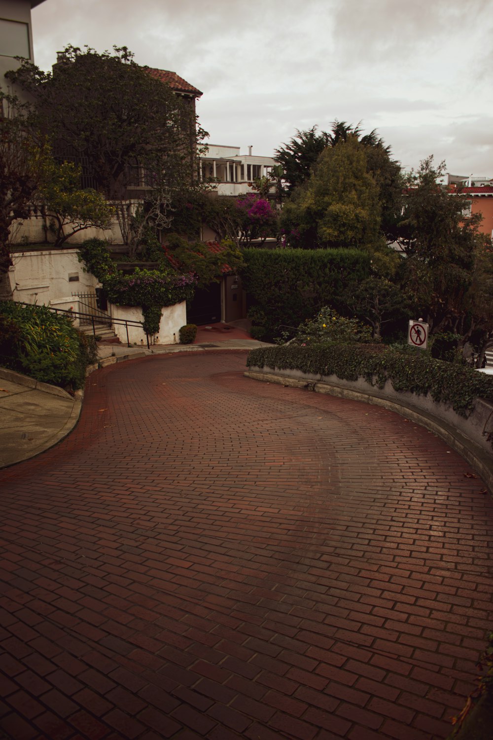 a red brick road with a stop sign on it