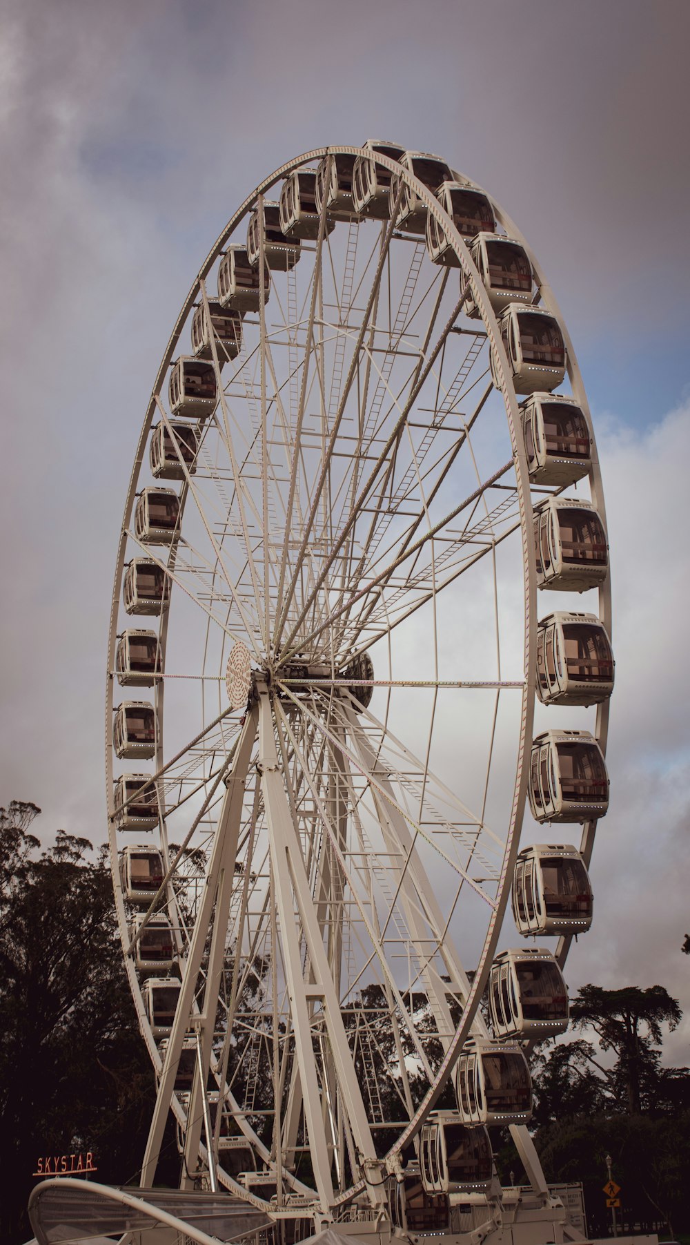 a large ferris wheel on a cloudy day