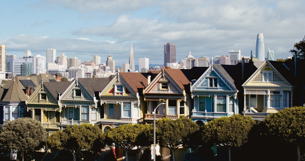 a row of houses with a city in the background