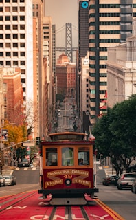 a trolley car traveling down a city street