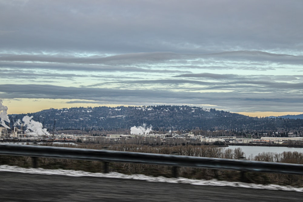 a view of a factory with smoke coming out of it