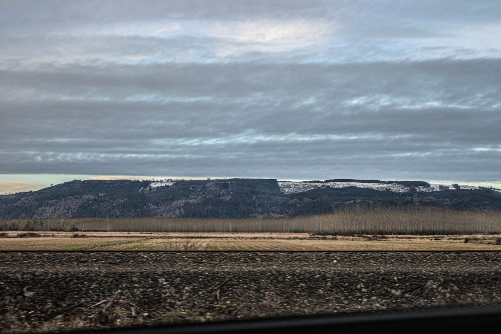 a view of a mountain from a train window