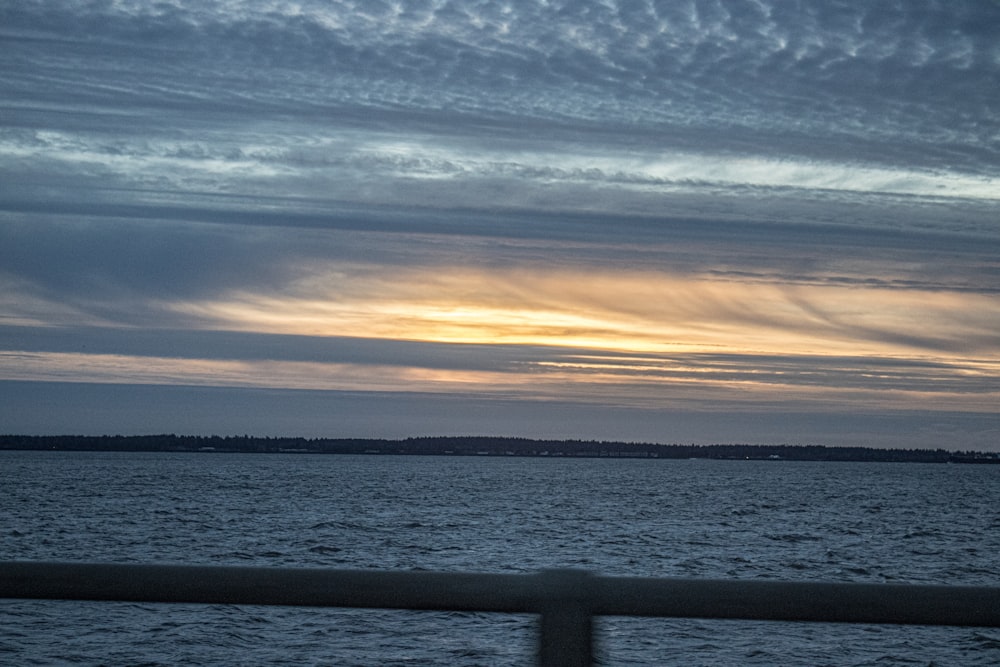 a view of a body of water at sunset