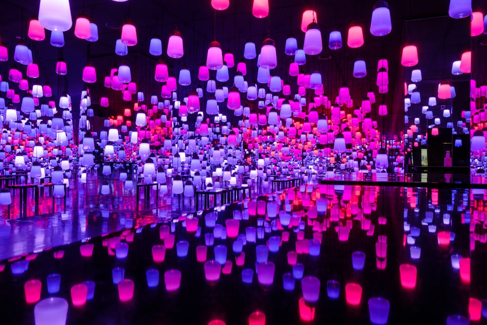 a room filled with lots of pink and purple lights