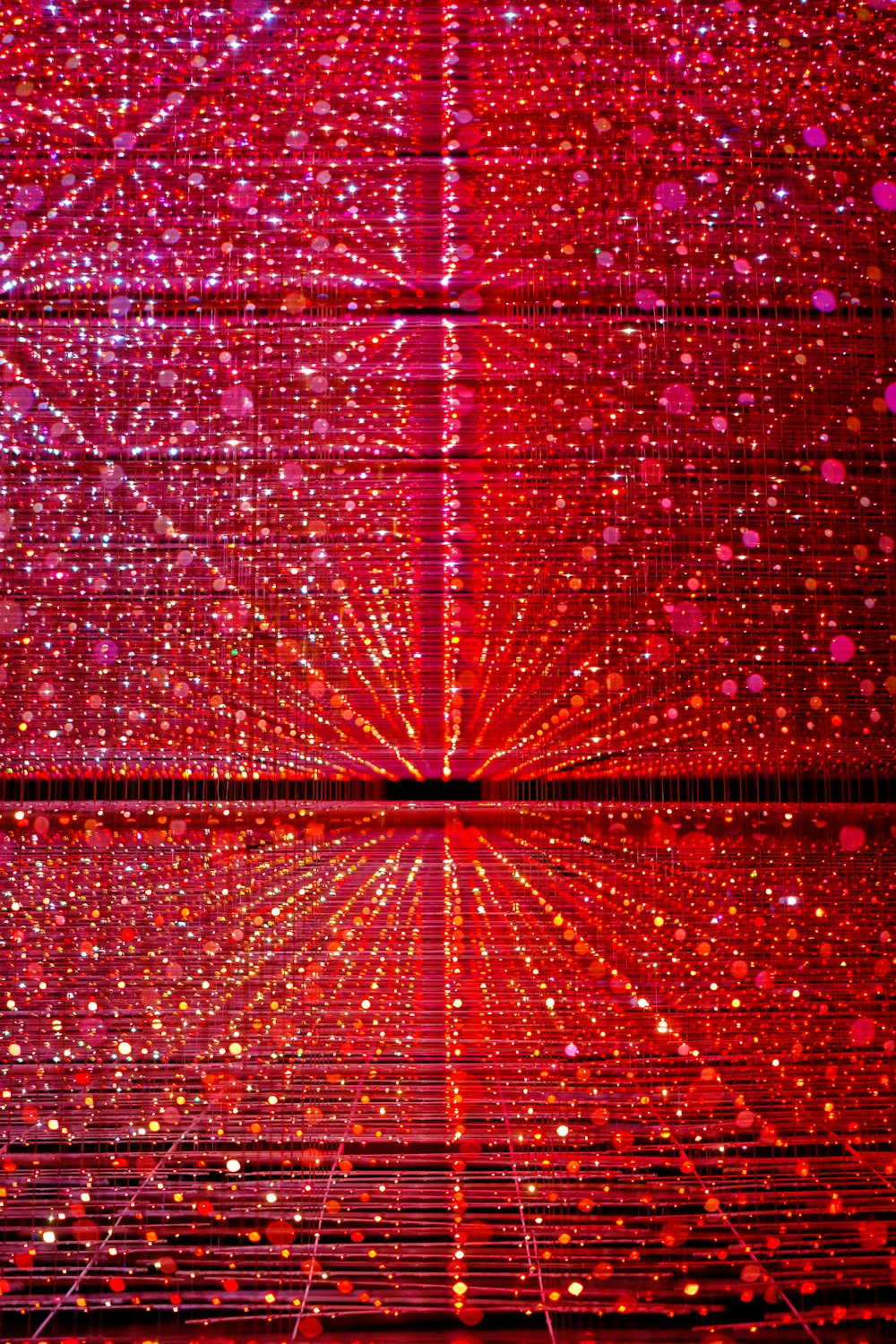 a red and pink background with a star burst
