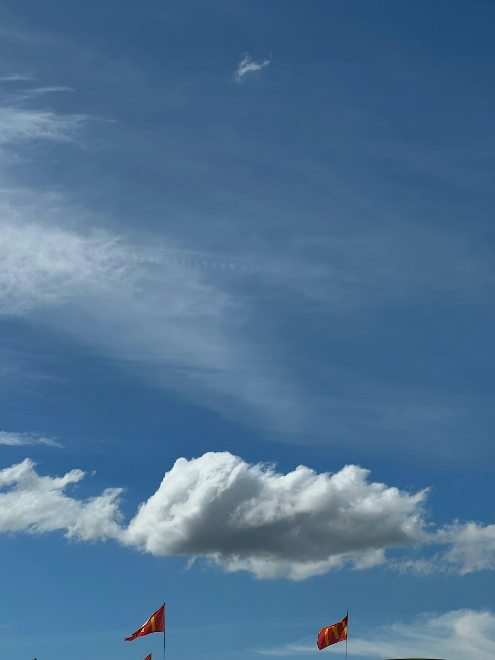 a group of flags flying in the sky