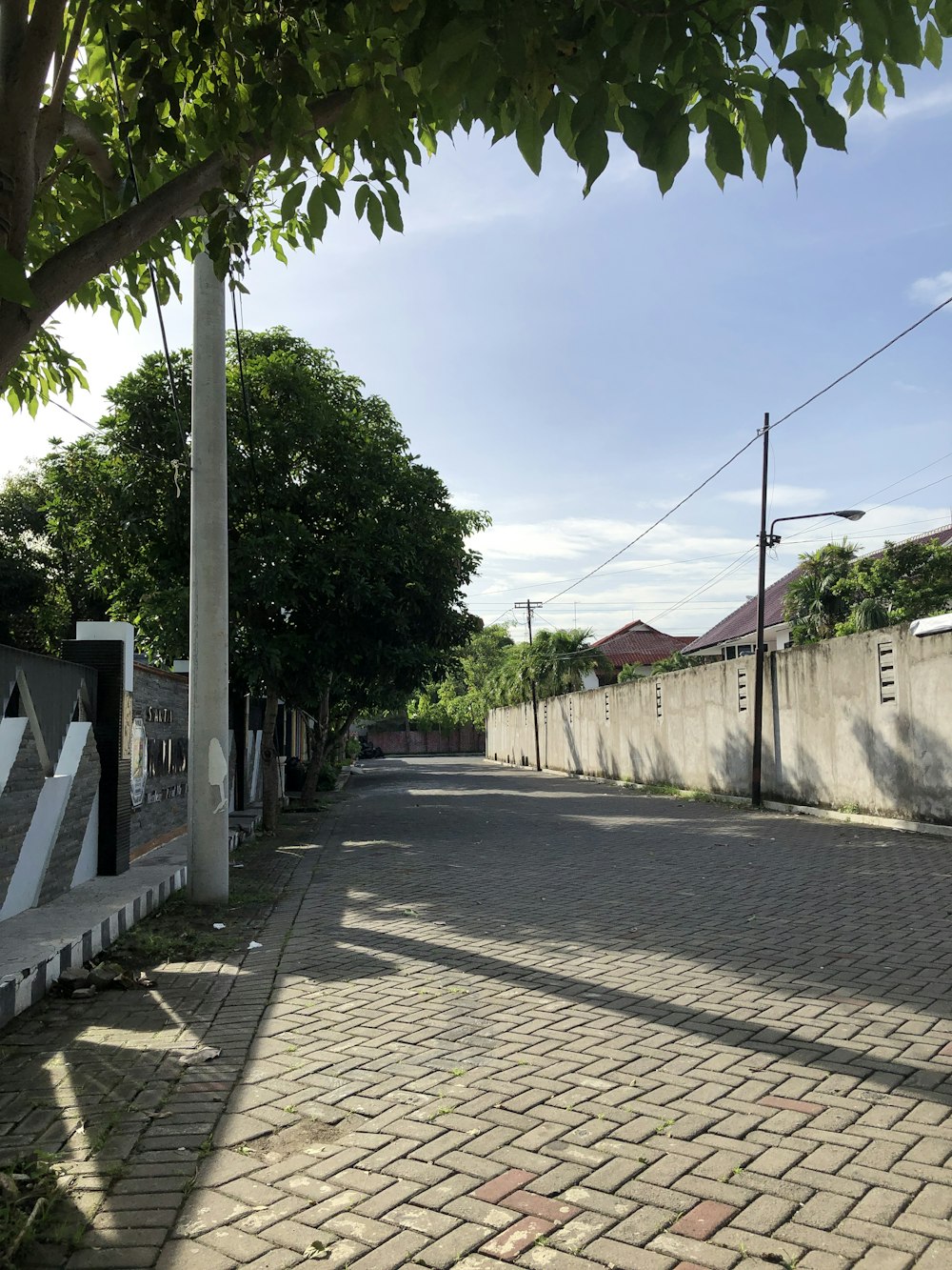 an empty street with a stop sign on the side of it