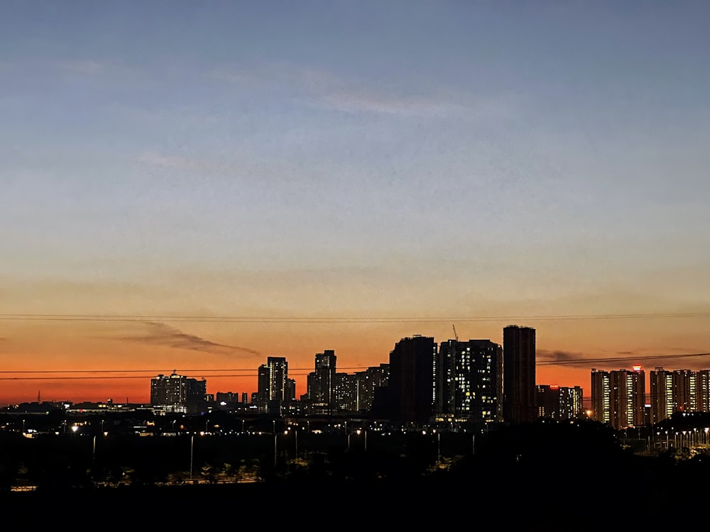 a view of a city skyline at sunset