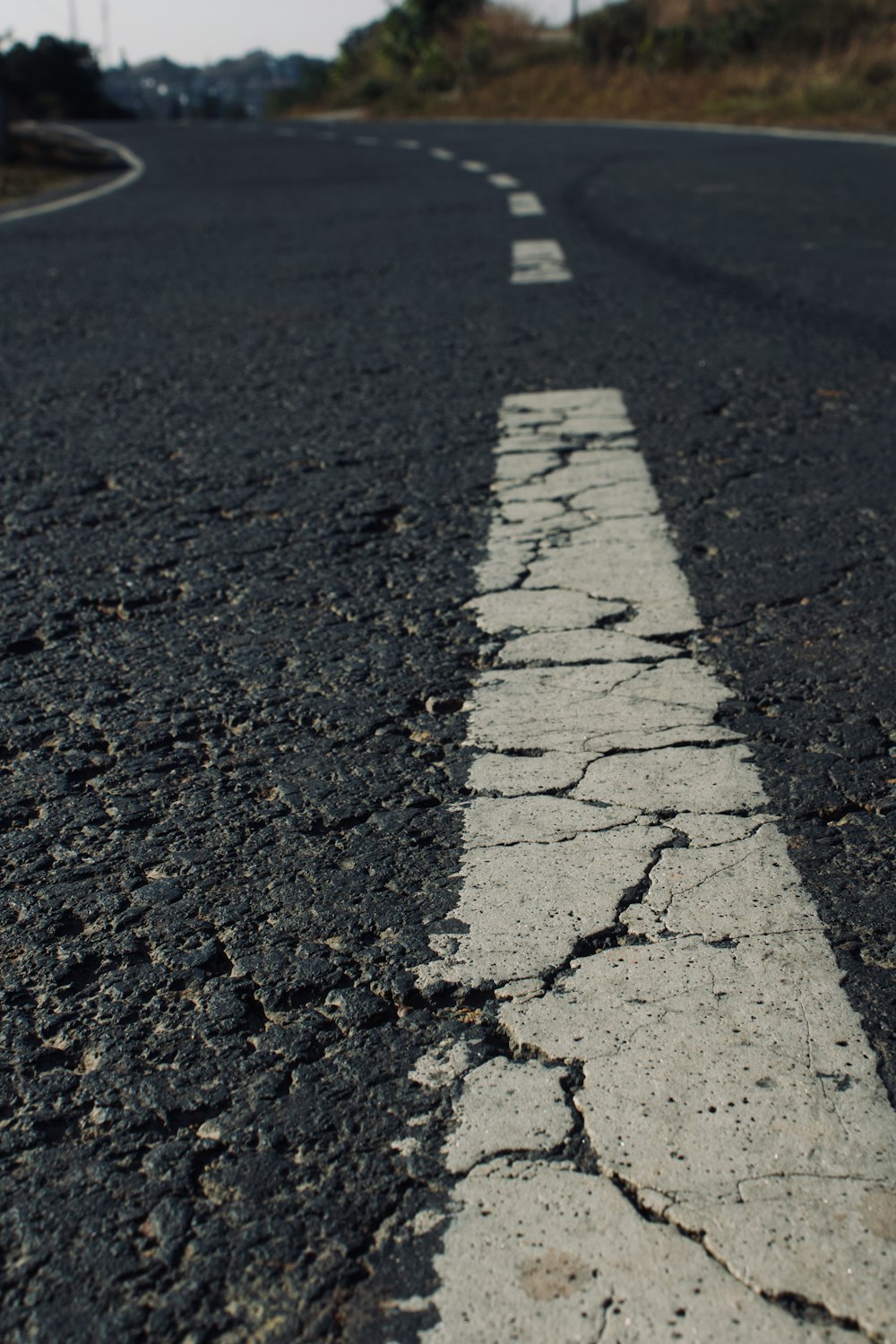 an empty street with a white line painted on it