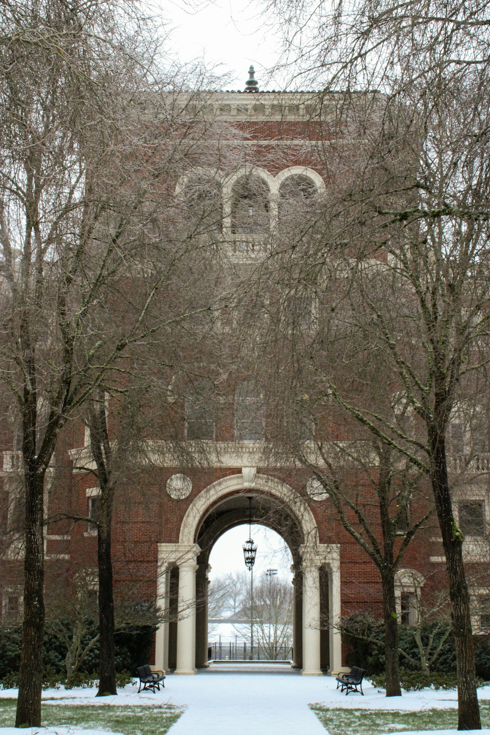 a large brick building with a clock tower in the middle of it