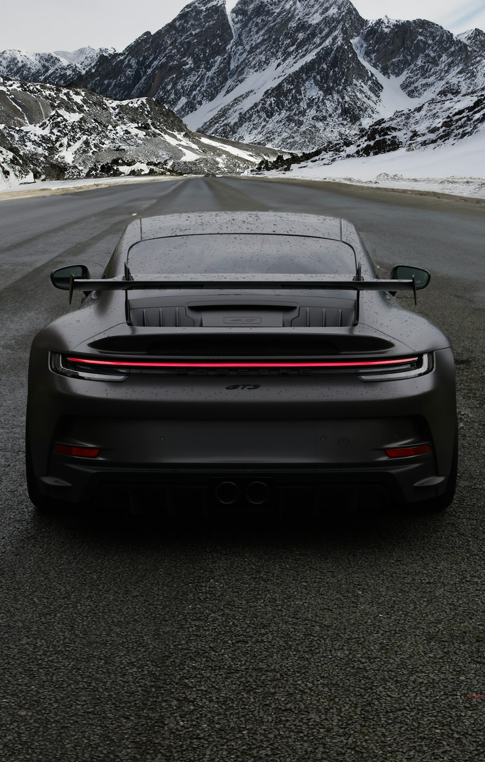 the rear end of a black sports car