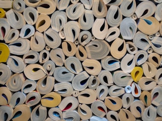 a pile of different types of scissors on a table
