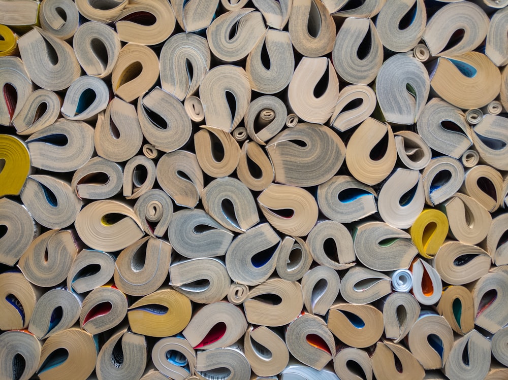 a pile of different types of scissors on a table