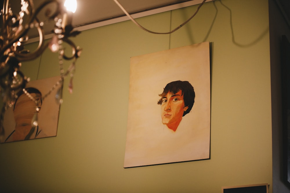 a painting of a man is hanging on the wall