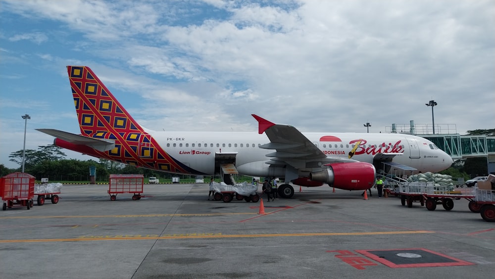 a large jetliner sitting on top of an airport tarmac