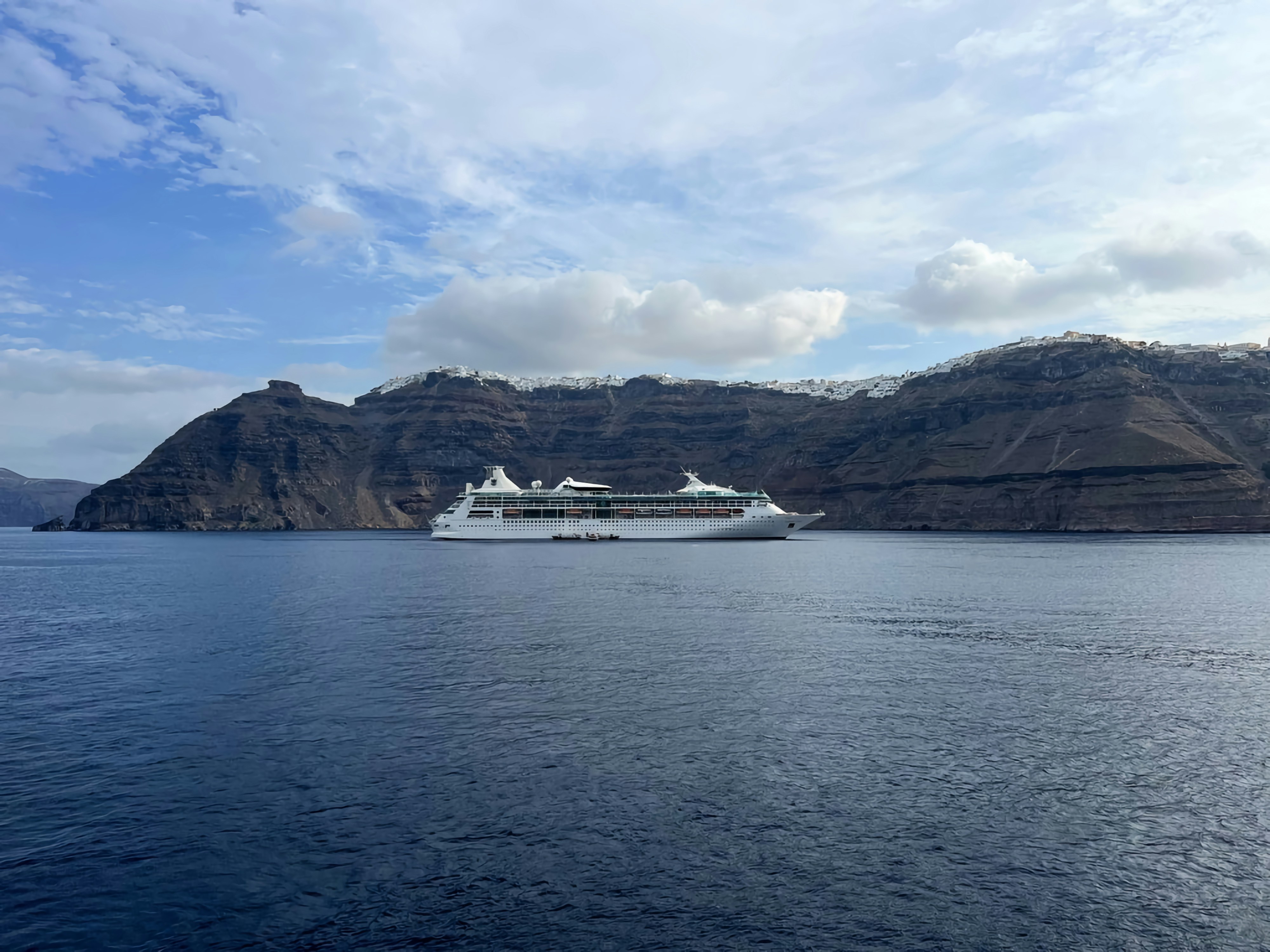 a cruise ship in a large body of water, 