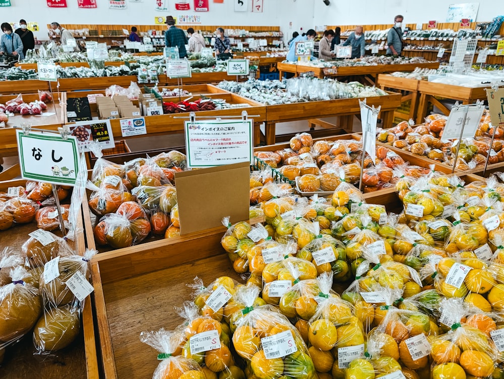 a store filled with lots of bags of fruit