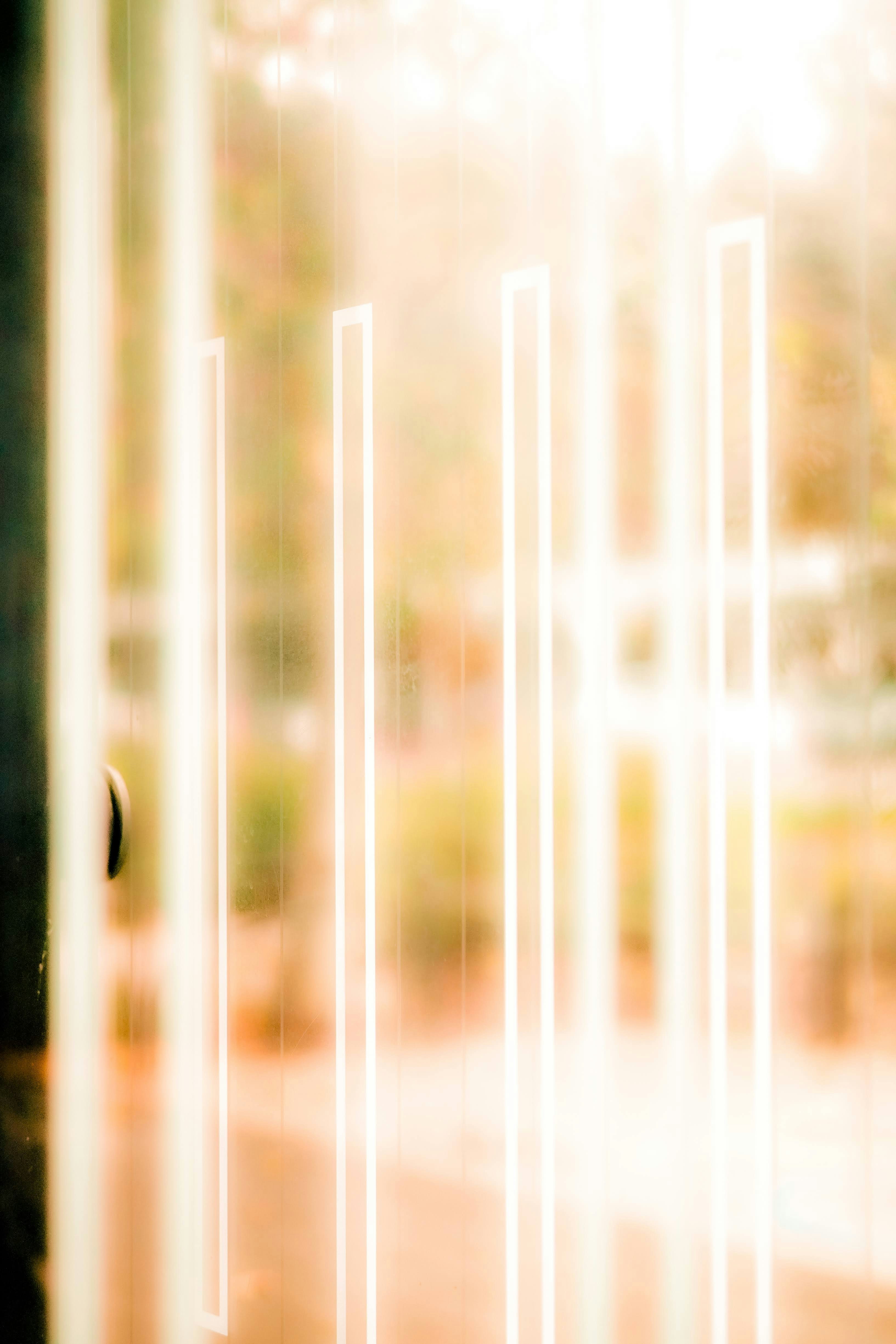 a close up of a window with a blurry background