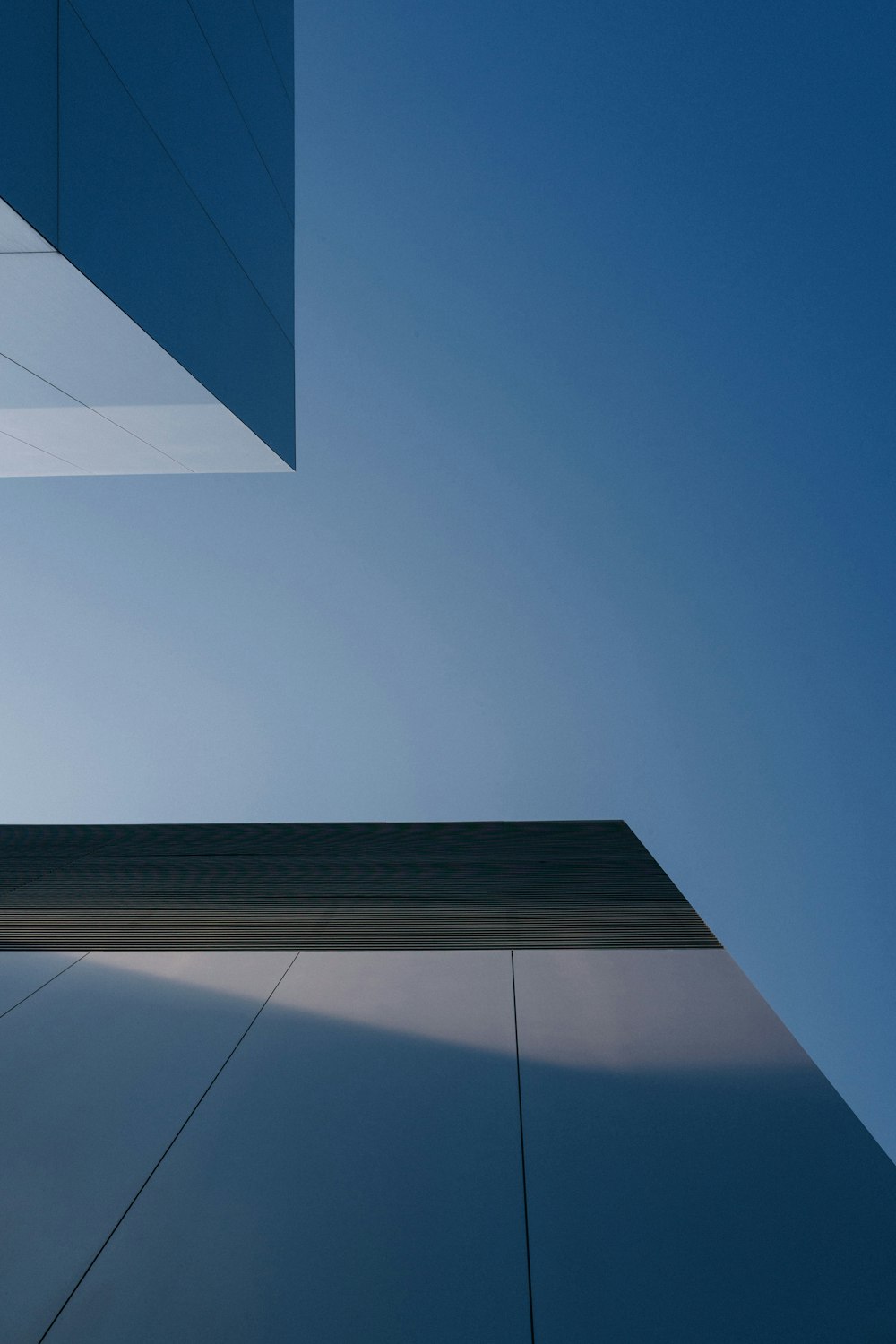 a tall building with a sky in the background