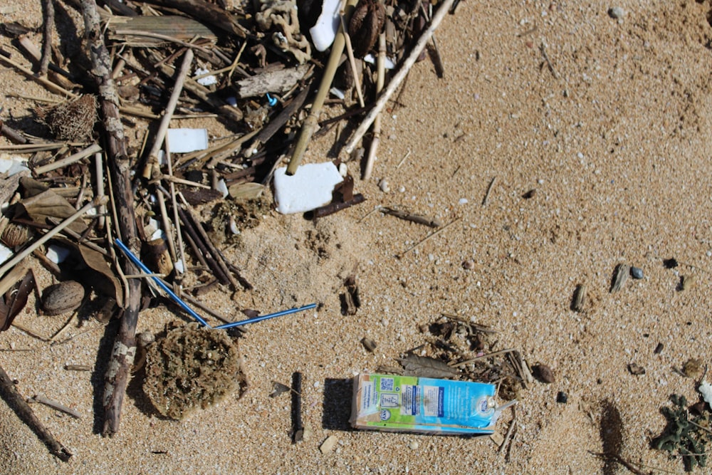 a broken cell phone laying in the sand