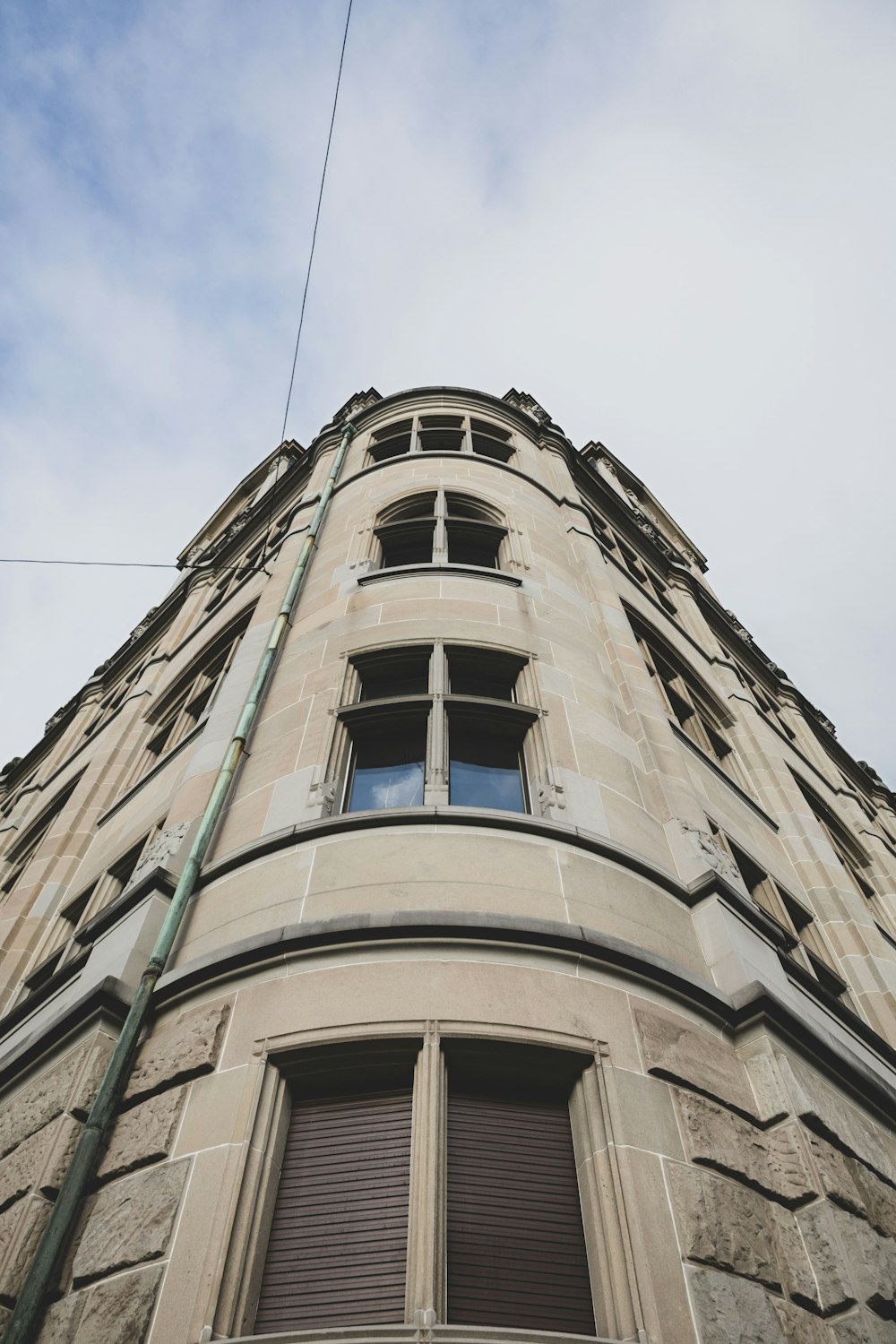 a tall building with a sky background