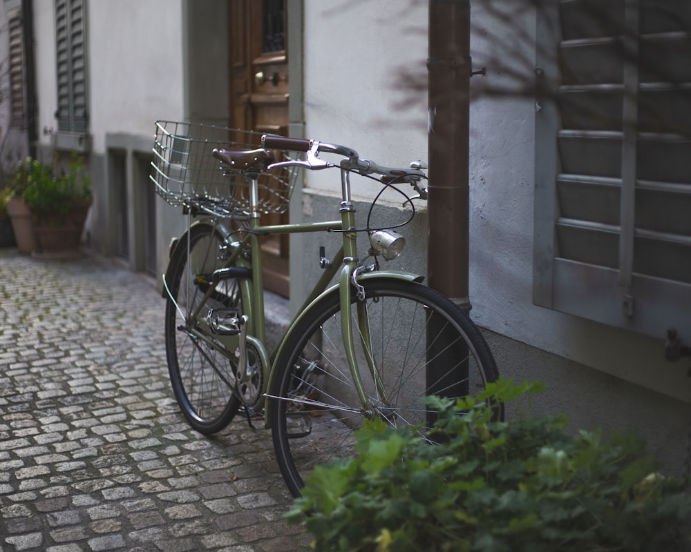 a bicycle parked on the side of a building