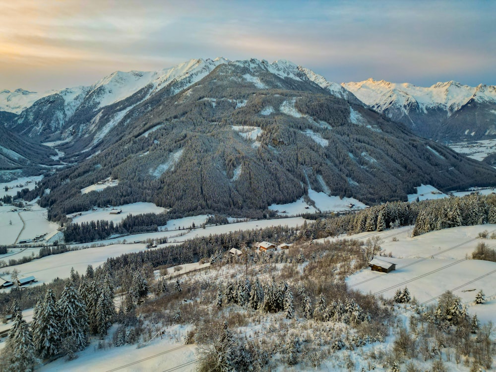 a view of a snowy mountain range from a helicopter