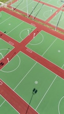 an overhead view of a basketball court with a red and green field