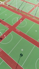 an overhead view of a basketball court with a red and green field
