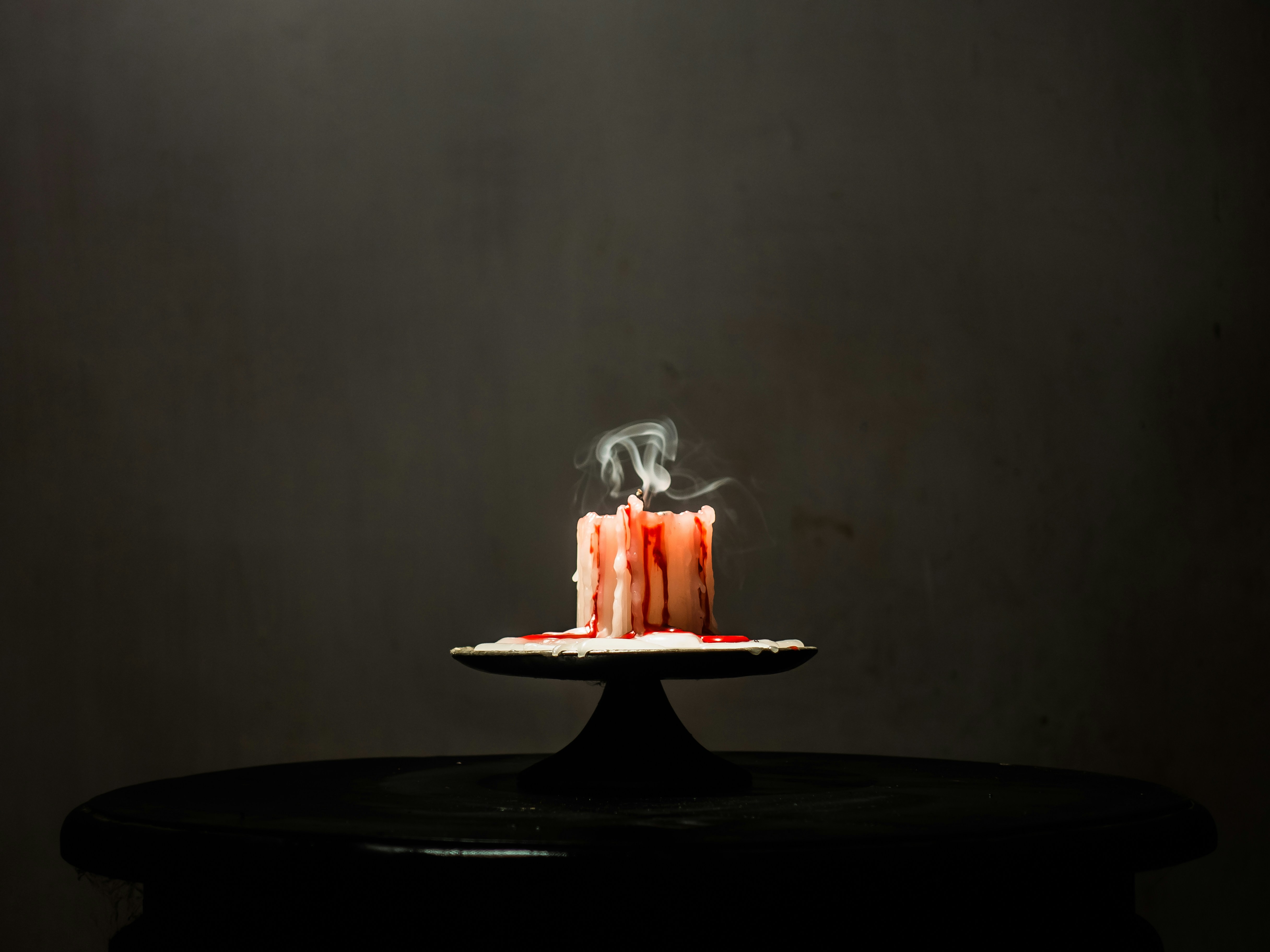 a cake with a lit candle on top of it